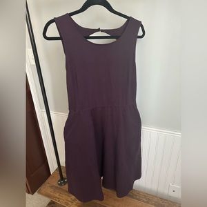 Cute plum colored fit-n-flare style dress. Diamond cutout on back. Pockets!